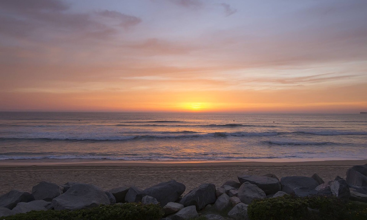 Imperial Beach Condo | Relax on the deck patio or beach and watch the dolphins frolicking in the waves