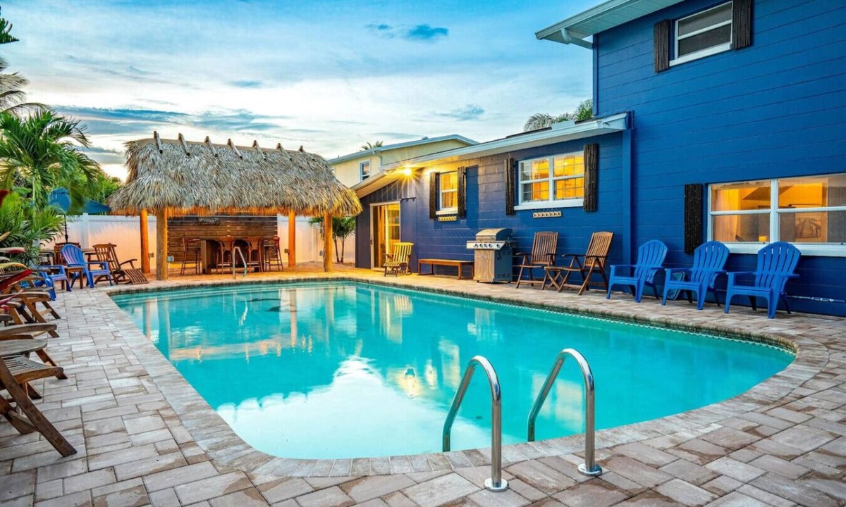 Cocoa Isles House | TIKI BLUE Big beach house with heated pool, hot tub and Tiki Bar.