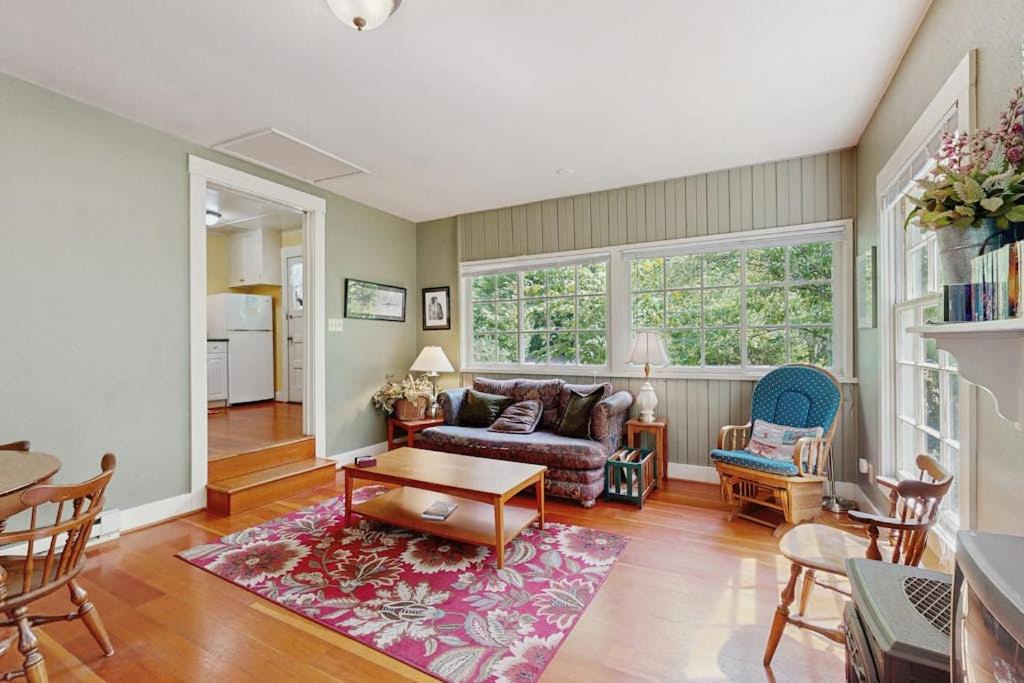Molalla House | Tranquil landscape with riverside firepit gas grill gas fireplace and deck