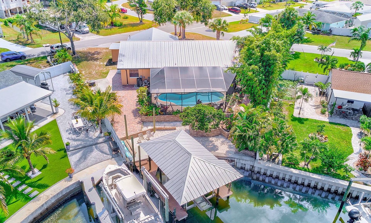 Apollo Beach House | Waterfront Oasis w/screened Lanai & Heated Pool, Private Dock + Kayaks 3BR/2BA