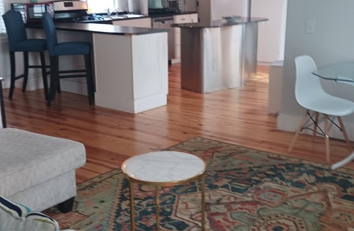 Sabattus House | Beautifully remodeled first floor of a duplex home, surrounded by privacy fence