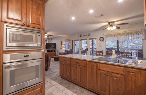 New Braunfels House | Bohemian Hill: NB Cypress-Lined Guadalupe Riverfront + Main & Guest House + Shady Decks & Backyard