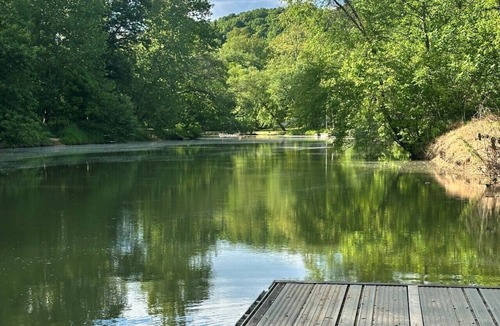 Gallipolis Ferry House | Brand new creekside home with hot tub, private dock and boat ramp!