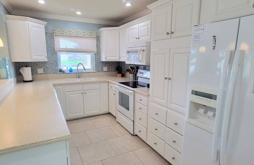 Cocoa Isles House | "Dive Into Fun! Spring & Summer Deals at Dolphin Cove – Walk to It All!"