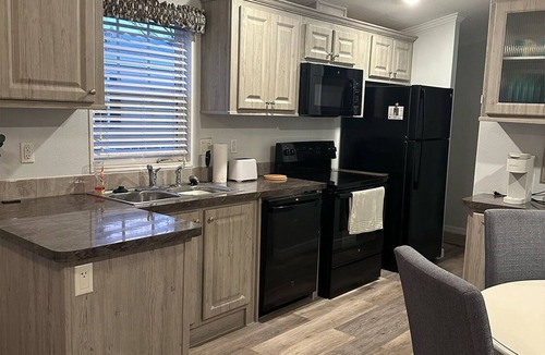 Dunedin Cottage | Duned-Inn: Where Dunedin Charm, Beach Days, and Pool Time Fun Collide