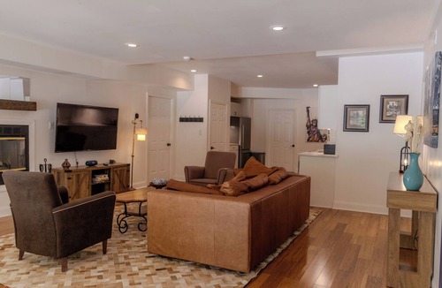Cold Harbor Apartment | Experience the New Amsterdam Nook, a modern 2-bed, 1-bath retreat in Mechanicsville. This European-inspired home features a full kitchen, private pool, hot tub, and playground. Comfortably accommodates up to 4 people.