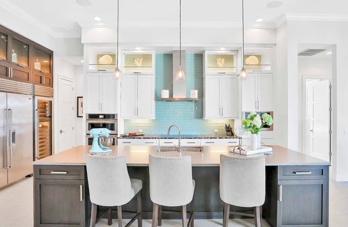 Island Estate House | Exquisite Clearwater Retreat w Heated Pool Game Room Outdoor kitchen and Kayaks