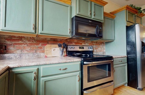 Portsmouth Apartment | Grab a latte at the coffee shop downstairs, then walk a block to the floodwall where you'll find 2000 feet of murals showcasing the history of Portsmouth. After that, walk back up 2nd Street and check out the antique shops and local restaurants.
