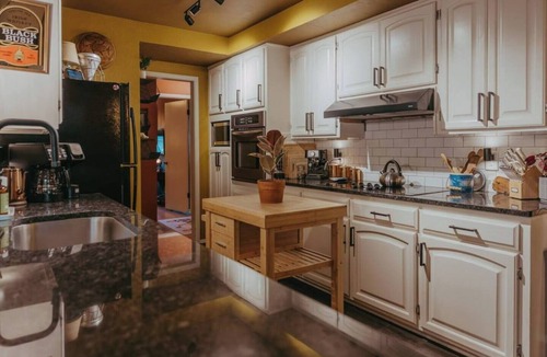 Wichita House | Mid-Century Charmer: Hot Tub, Stocktank Pool, Firepit, & Vintage Camper
