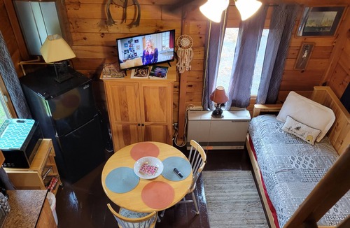 East Corinth Cabin | Modern log cabin with pond view available for rent in middle Maine.