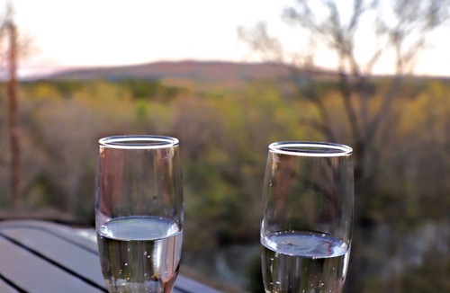 Caddo Gap RV Rental | Private River Tent Camping with Kayaks & Outdoor Bathhouse! Pet friendly!