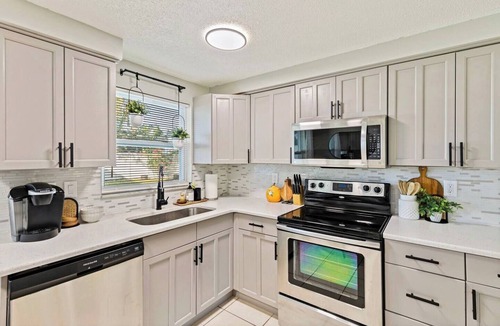 Pinellas Park House | Right at Home Stays - Modern 2BR 2BA w/Yard & Fireplace