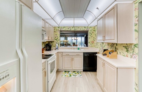 Sand Key House | Second floor condo with pool and tennis court private WD and central AC