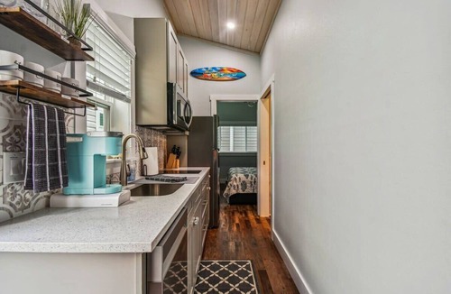 Dunedin House | Surf Shack Tiny Home on Pinellas Trail w/Heated Pool! Walk or Bike to Downtown Dunedin!