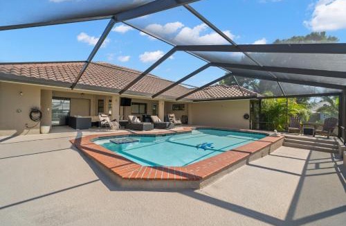 Apollo Beach House | Surfside Beach House - Gorgeous Canal Front Home - Heated Pool & Boat Dock