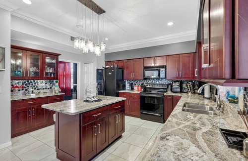 Brandon House | Tampa Mansion: Theater, Pool, Fire Pit & Sleeps 10