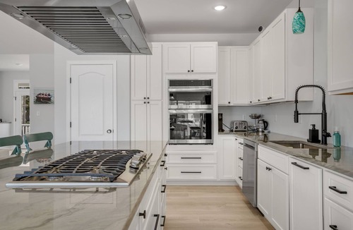 Greenbackville House | The Lighthouse | Luxury Waterfront Retreat w/Dock, Fireplace, Pools, Marina, & Golf