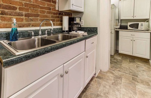 Old West Broad Neighborhood Apartment | This Classical Parlor is located on Chatham Square. It offers a quiet retreat with natural light, floor-to-ceiling windows, and views of the Square.