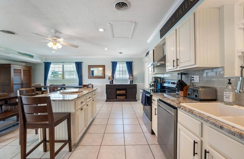 Cocoa Isles House | TIKI BLUE Big beach house with heated pool, hot tub and Tiki Bar.