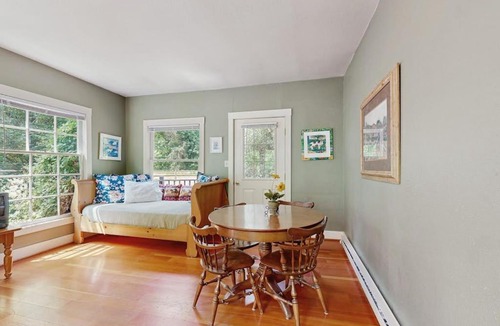 Molalla House | Tranquil landscape with riverside firepit gas grill gas fireplace and deck