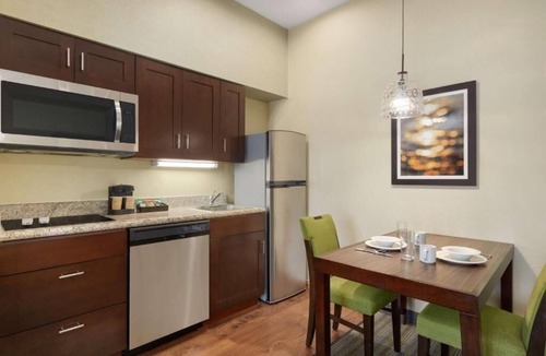 Feather Sound Hotel | Unwind and Indulge In Our Oasis! Outdoor Pool, Free Breakfast, Full Kitchen!