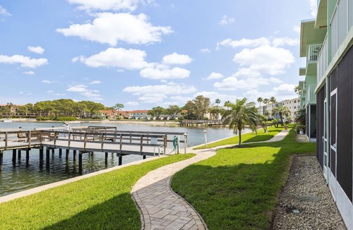 Dunedin Condo | Waterfront Escape! Heated Pool, BBQ, Clubhouse & Pier – Dolphins & Sunsets from Your Private Porch!