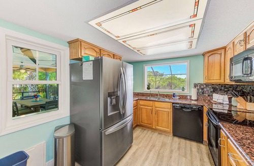 Apollo Beach House | Waterfront Oasis w/screened Lanai & Heated Pool, Private Dock + Kayaks 3BR/2BA