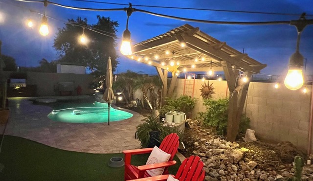 A pet-friendly cozy 4 bedroom home with a resort style pool in the backyard.
