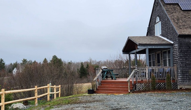 Beautiful and modern cape style cottage nested along the Jordan Tidal River.