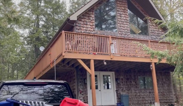 Beautiful beachfront chalet with southern exposure on Green Lake,Dedham, Maine.