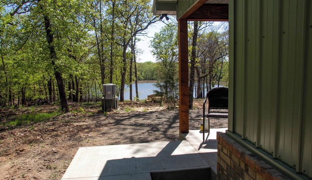 Cabin Bunkhouse with Hot Tub on Private Lake, Fire Pit & Swings in Vian, OK!