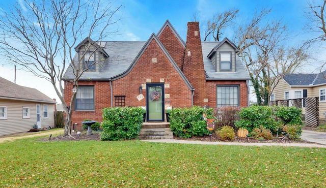 Charming Tudor Retreat in Perfect Location with Fenced Yard and Garage