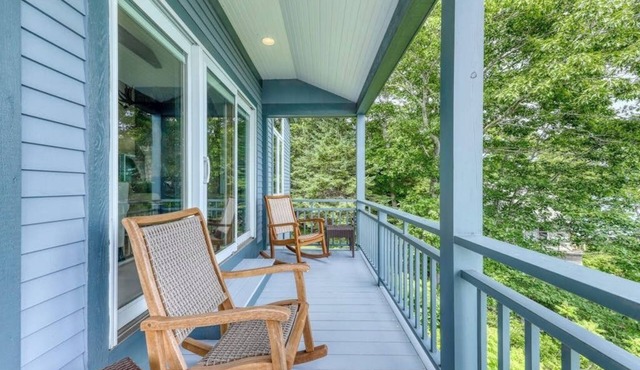 Delightful oceanfront home with amazing views, wrap-around deck & two fireplaces