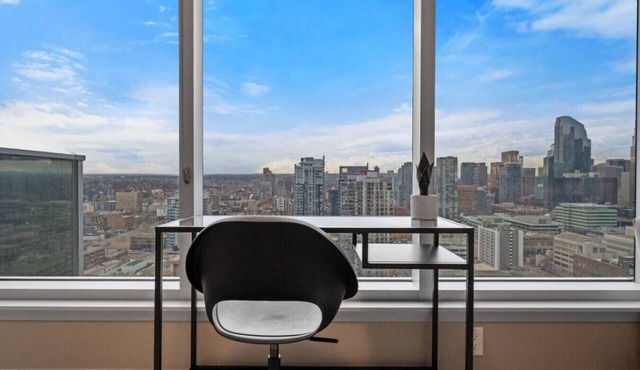 DT Views | Walk to Saddledome| 2BR | UG Parking|AC