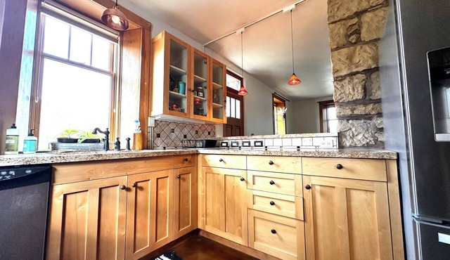 Historic Stone Home Under Bright Canyon Skies