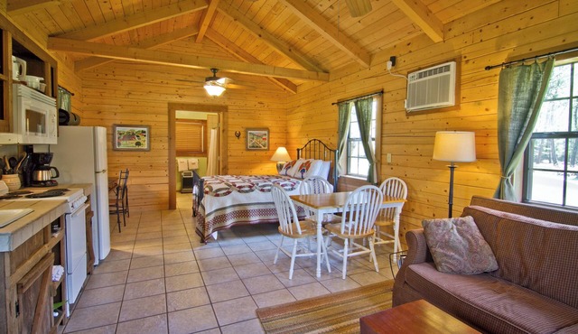 Log cabin overlooking a private lake on a working farm