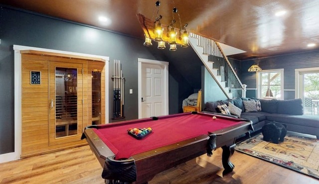 Luxurious waterfront home with deck, firepit, hot tub, fireplace, & pool table