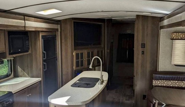 Private camp site on Sand Pond, nicely furnished RV & your own private dock! in Litchfield