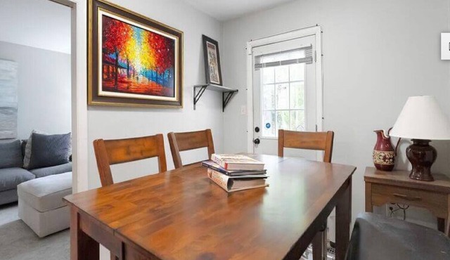 Spacious 4-bedroom townhome in Alexandria with parking and exercise equipment.