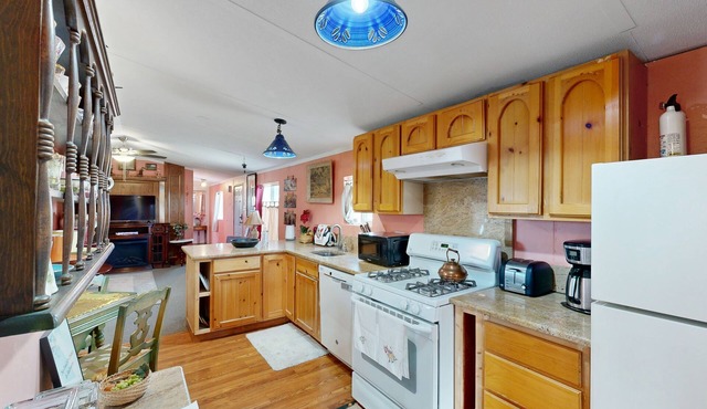 Spacious, single-level retreat with a large yard, washer/dryer, & full kitchen