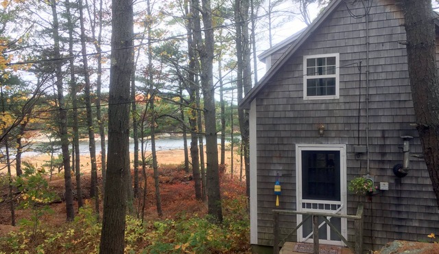 Waterfront Cottage with Screened Porch surrounded by conservation land