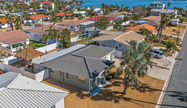 Welcome to BLUE PALMS, St Pete Beach Home, heated Pool, 6 minute walk to beach