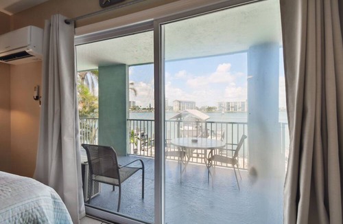 Bay Esplanade Apartment | Enchanted Inn Suite #6: Waterfront, Pool, Fishing Dock, Boat Docks & Tiki Bar!