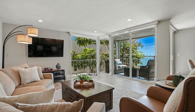Bay-view 2BR condo in Crown Point with pool, patio, and beach access.
